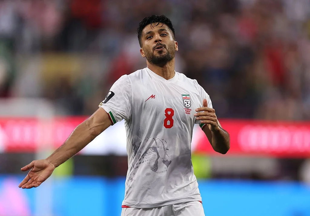 The most striking imagery on Iran's home (white) and away (red) kits is an Asiatic cheetah low across the front